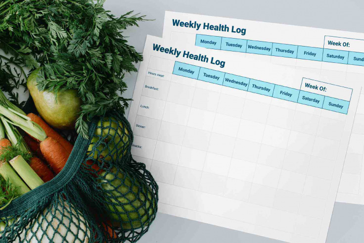 Weekly nutrition log with a bag of vegetables