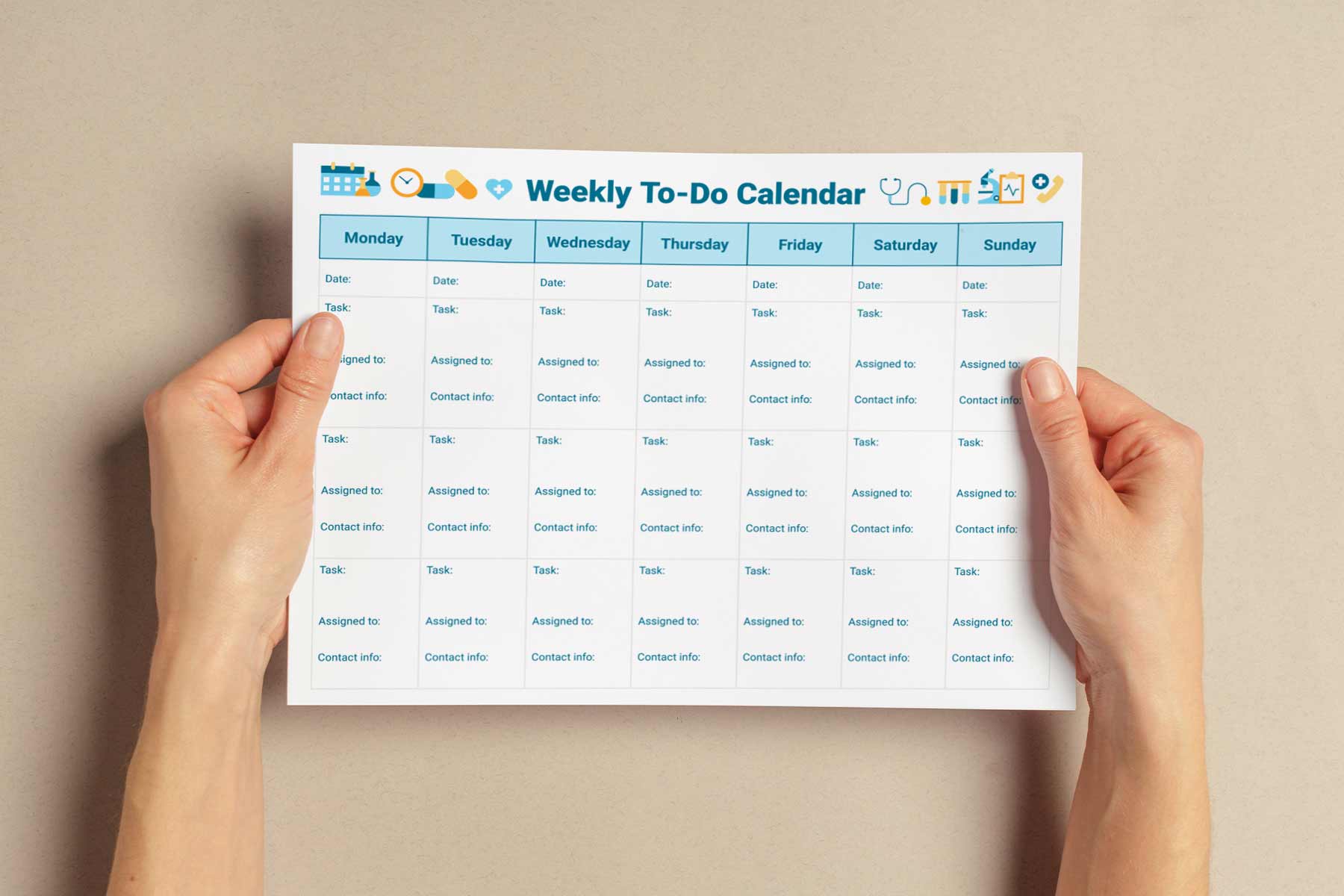 Someone holding a weekly to-do calendar