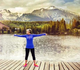Woman exercising near a lake