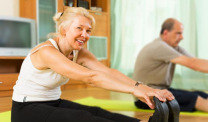 Older couple exercising at home