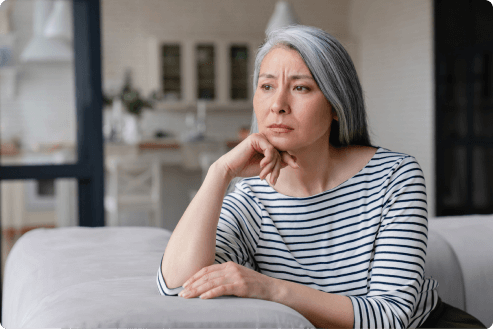 mature woman with depression sits thoughtfully while contemplating life