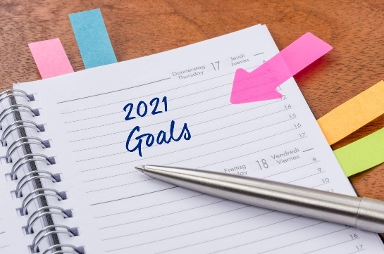 Planner with colored post-its and 2021 goals Planner with colored post-its and 2021 goals