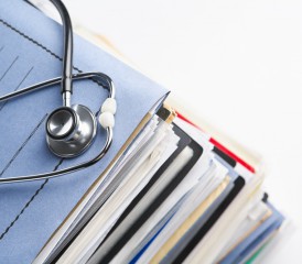 Stethoscope on top of medical files Stethoscope on top of medical files