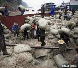 Chinese Workers Unloading Asbestos with No Protection Chinese Workers Unloading Asbestos with No Protection