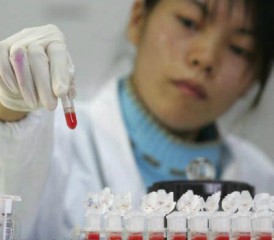 Researcher with samples in vials Researcher with samples in vials
