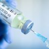COVID-19 vaccine vial with syringe COVID-19 vaccine vial with syringe