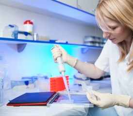 Researcher testing samples in lab Researcher testing samples in lab