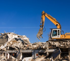 Tractor demolishing a building Tractor demolishing a building