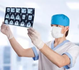 Male doctor examines X-rays Male doctor examines X-rays