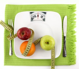 Scale with fruits, measuring tape and utensils Scale with fruits, measuring tape and utensils