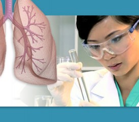 Female researcher looking at test tube Female researcher looking at test tube