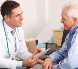Oncologist and patient Oncologist and patient