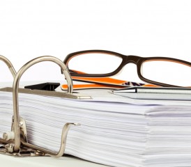 Eyeglasses on bound documents Eyeglasses on bound documents