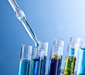 Test tubes filled with liquid and a dropper Test tubes filled with liquid and a dropper