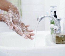 Washing hands with soap under running water Washing hands with soap under running water