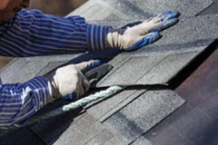 Man working on roofing shingles