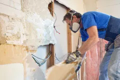 Man working on drywall