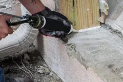 Man working with caulking