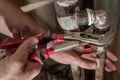 Man working on plumbing fixtures