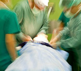 Doctors operating on a patient Doctors operating on a patient