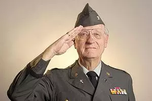 Older veteran of the U.S. Army saluting