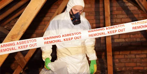 Asbestos removal professional in protective suit