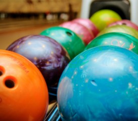 Bowling balls in a rack Bowling balls in a rack