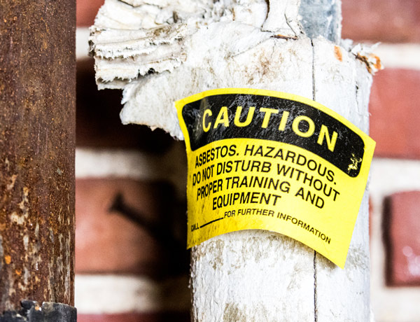 Warning on asbestos pipe insulation Warning on asbestos pipe insulation