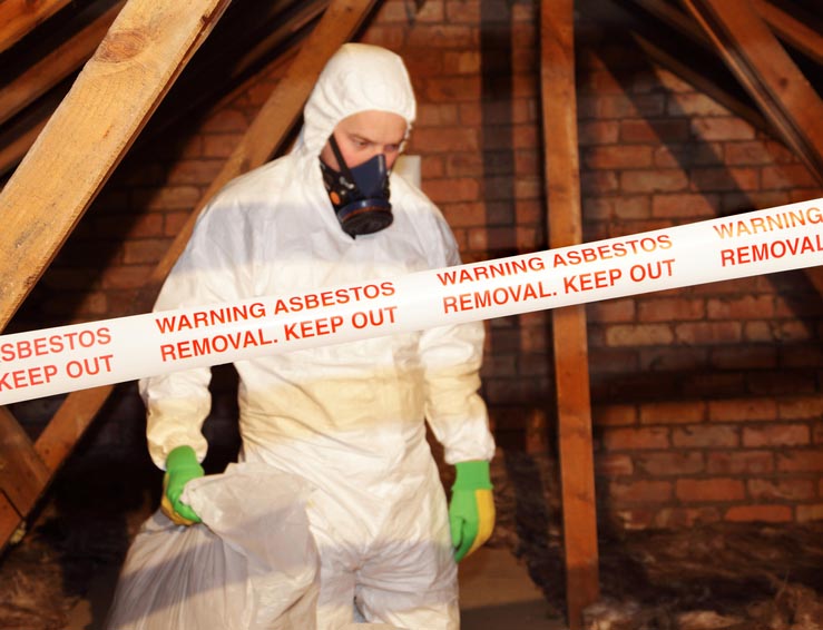 Man removing asbestos Man removing asbestos