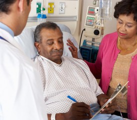 Black patient with wife at a hospital Black patient with wife at a hospital