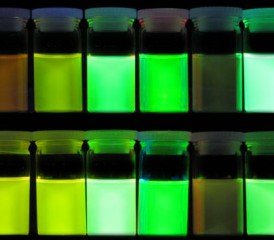 Glowing green cancer dyes in bottles Glowing green cancer dyes in bottles