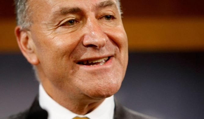 U.S. Sen. Charles Schumer of New York stands against FACT Act