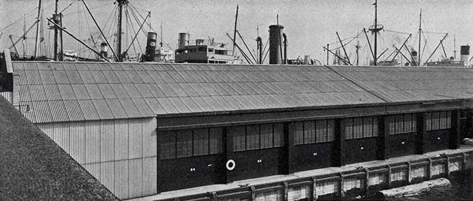 Dock warehouse with corrugated transite asbestos concrete panels