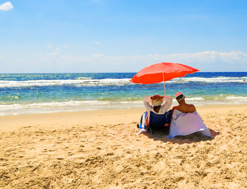 Couple relaxing on the beach Couple relaxing on the beach
