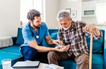 Doctor assisting a patient