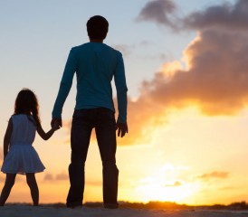 Daughter with her father looking at the sunset Daughter with her father looking at the sunset