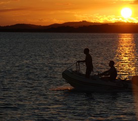 Couple Sailing on a Dinghy Couple Sailing on a Dinghy
