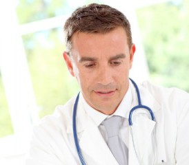 Male doctor with a stethoscope and white coat Male doctor with a stethoscope and white coat