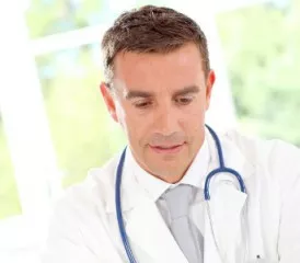 Male doctor with a stethoscope and white coat Male doctor with a stethoscope and white coat