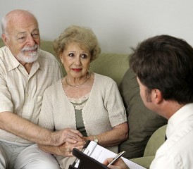 Elderly Couple Receiving News from a Doctor Elderly Couple Receiving News from a Doctor