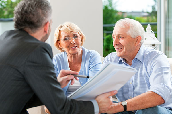 Mesothelioma lawyers speaking with an older family.