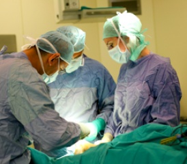 Surgeons operating on a patient