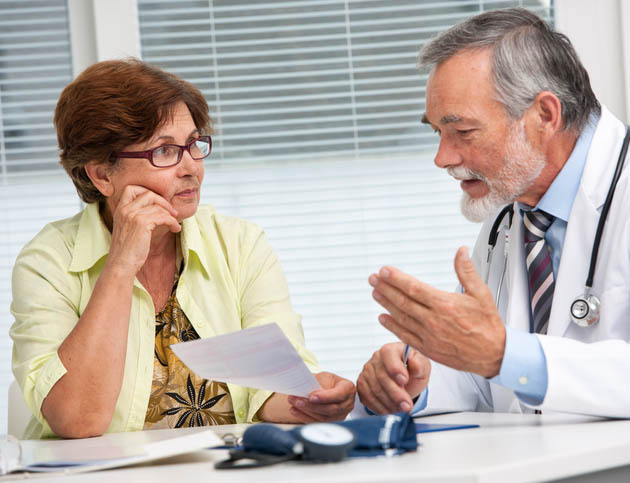 Doctor explains exam to patient Doctor explains exam to patient