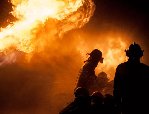 Firefighters trying to put out a fire