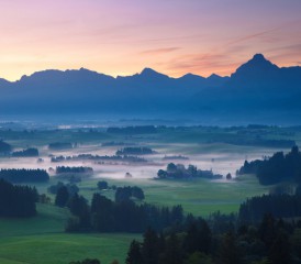 Serene scene of a mountain and clouds Serene scene of a mountain and clouds