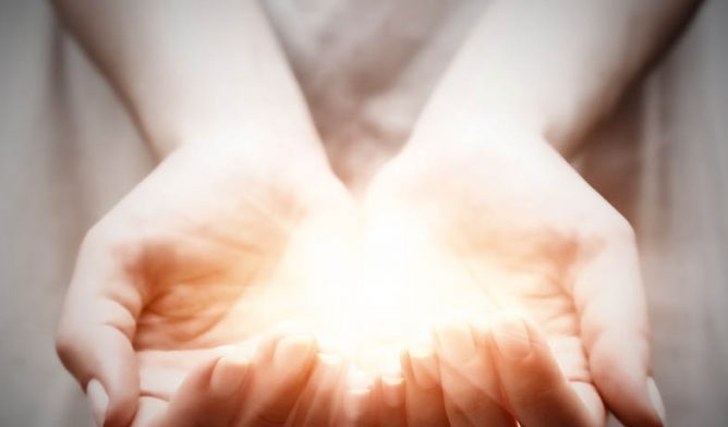 Hands holding light