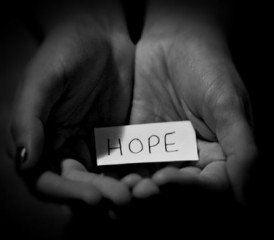 Hands holding a message of hope Hands holding a message of hope