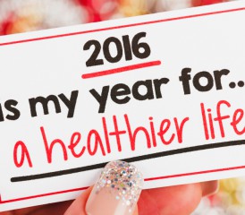 Person holding healthy New Year's Resolution card Person holding healthy New Year's Resolution card
