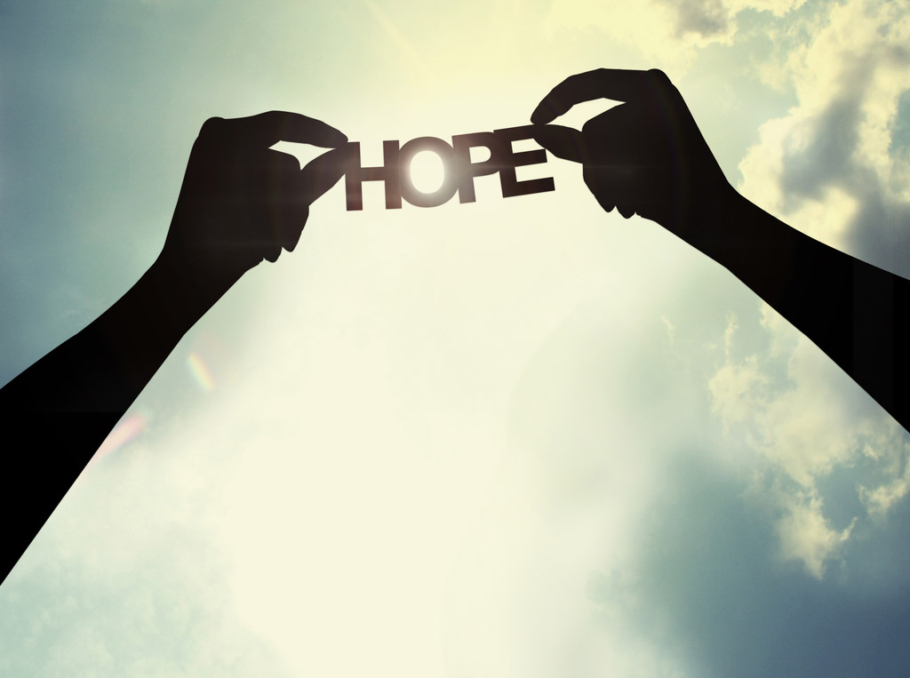 Holding paper cut of hope Holding paper cut of hope