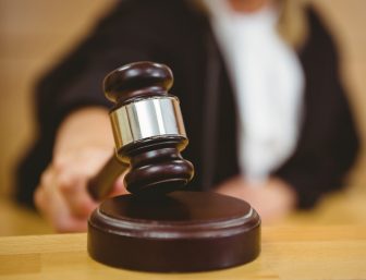 Judge with hand on gavel